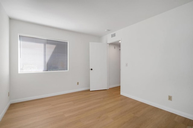 11215 Avenida De Los Lobos Unit F, Rancho Bernardo San Diego, CA 92127 - spare room featuring light wood-style flooring and baseboards