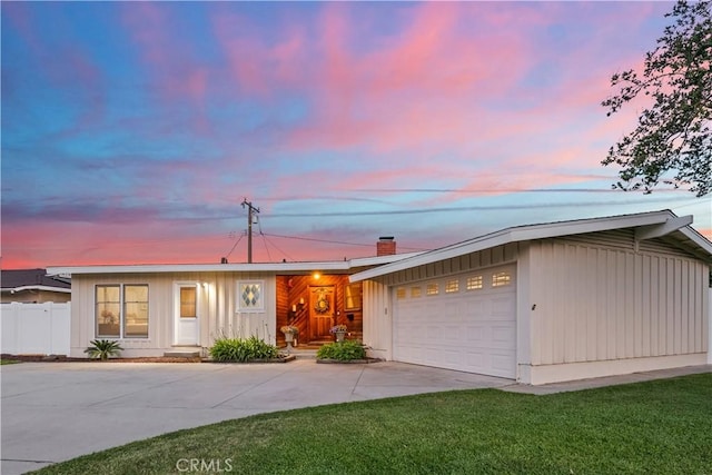 1418 S Sandsprings Dr, West Covina, CA 91790 - view of front of house with driveway, a garage, and board and batten siding