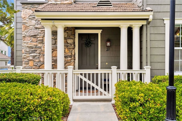 25 Ellsworth St Unit 11, Ladera Ranch, CA 92694 - property entrance featuring stone siding and covered porch
