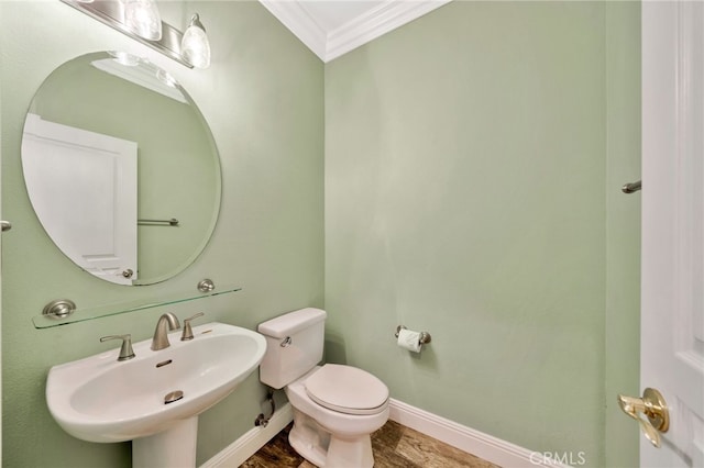 25 Ellsworth St Unit 11, Ladera Ranch, CA 92694 - half bath with crown molding, a sink, toilet, wood finished floors, and baseboards