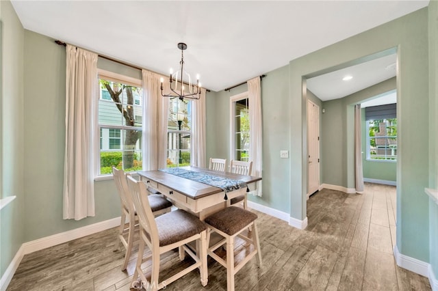 25 Ellsworth St Unit 11, Ladera Ranch, CA 92694 - dining room with a chandelier, light wood-style floors, and plenty of natural light