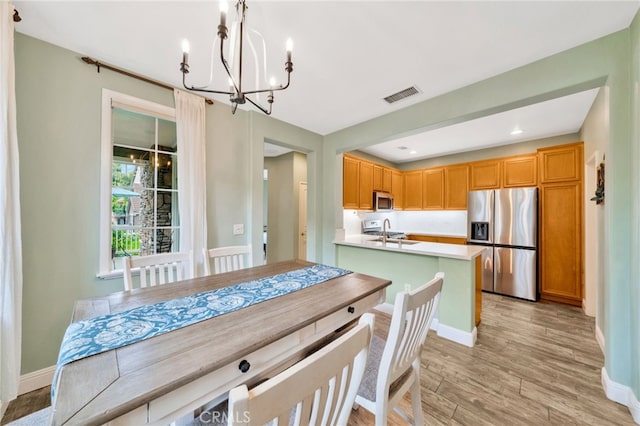 25 Ellsworth St Unit 11, Ladera Ranch, CA 92694 - dining space with a chandelier, light wood-type flooring, baseboards, and recessed lighting