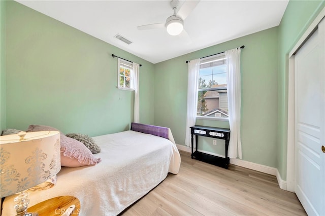 25 Ellsworth St Unit 11, Ladera Ranch, CA 92694 - bedroom with light wood-type flooring, baseboards, a closet, and a ceiling fan