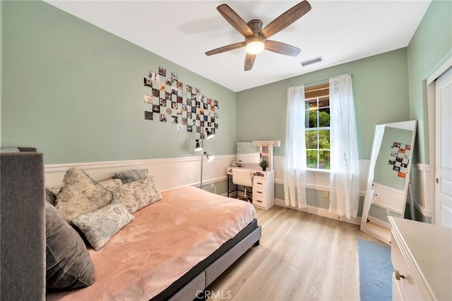 25 Ellsworth St Unit 11, Ladera Ranch, CA 92694 - bedroom with wood finished floors, a wainscoted wall, and ceiling fan