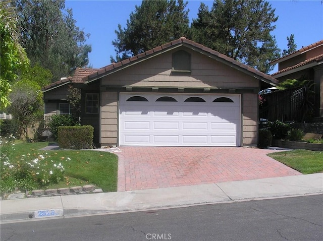 28265 La Bajada, Laguna Niguel, CA 92677 - ranch-style home featuring decorative driveway, an attached garage, and a tiled roof