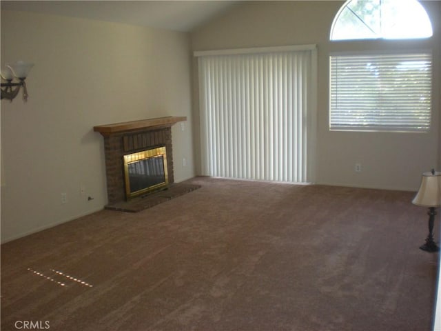 28265 La Bajada, Laguna Niguel, CA 92677 - unfurnished living room with carpet, plenty of natural light, a fireplace, and lofted ceiling