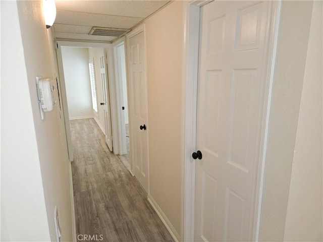 4734 Park Granada Unit 238, Calabasas, CA 91302 - hall with wood finished floors, baseboards, and a paneled ceiling