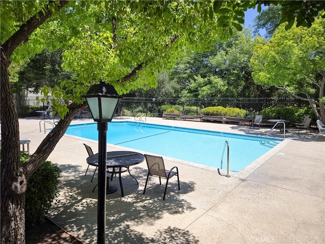 4734 Park Granada Unit 238, Calabasas, CA 91302 - community pool featuring a patio area and view of scattered trees