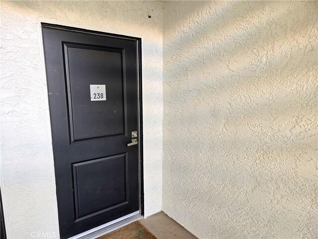 4734 Park Granada Unit 238, Calabasas, CA 91302 - doorway to property featuring stucco siding