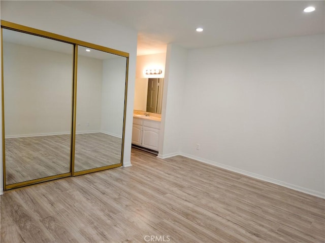 4734 Park Granada Unit 238, Calabasas, CA 91302 - unfurnished bedroom featuring light wood finished floors, recessed lighting, baseboards, and a closet