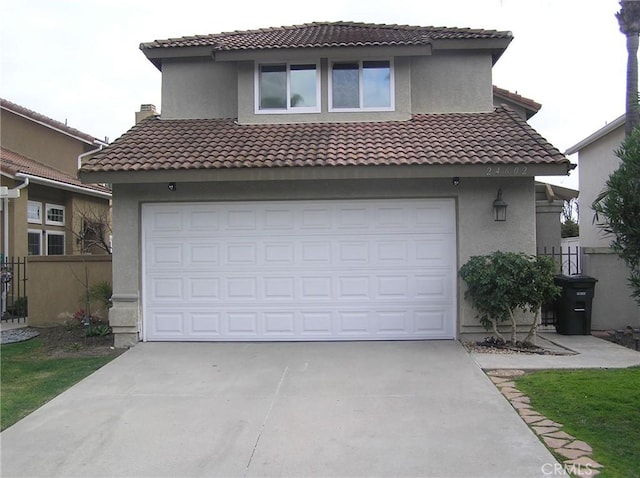 24602 Via Del Oro, Laguna Niguel, CA 92677 - mediterranean / spanish house with concrete driveway, stucco siding, and a tile roof