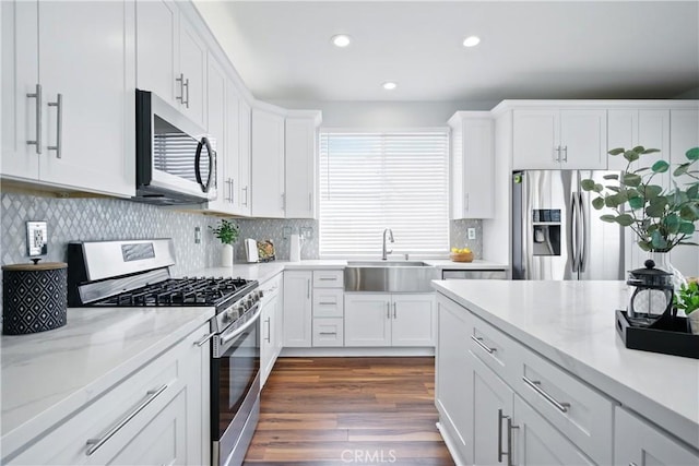 27170 Arrow Point Trl, Corona, CA 92883 - kitchen featuring stainless steel appliances, a sink, recessed lighting, white cabinets, and dark wood-type flooring