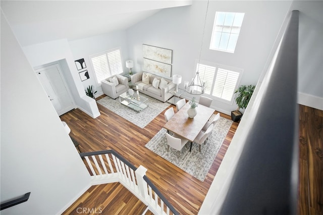 27170 Arrow Point Trl, Corona, CA 92883 - living room with high vaulted ceiling, baseboards, and wood finished floors