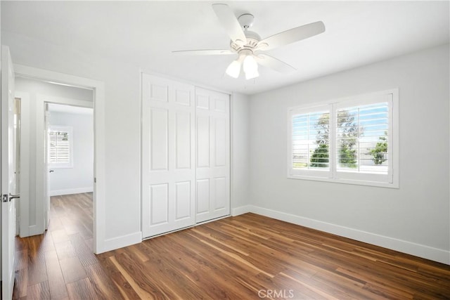 27170 Arrow Point Trl, Corona, CA 92883 - unfurnished bedroom with dark wood-type flooring, baseboards, a closet, and ceiling fan