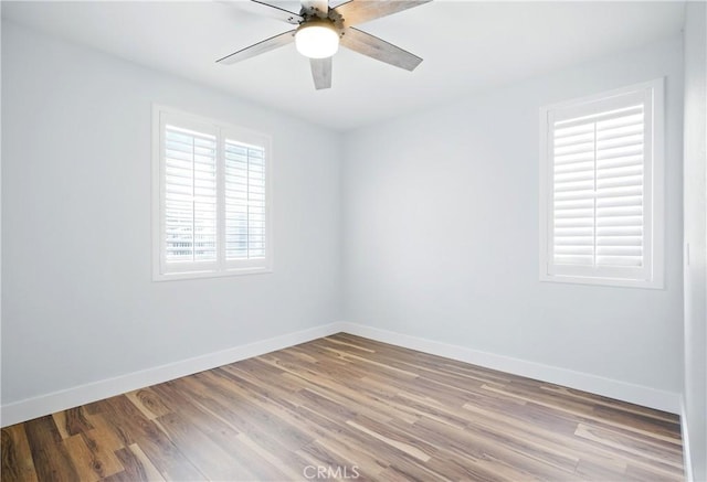 27170 Arrow Point Trl, Corona, CA 92883 - empty room featuring baseboards, wood finished floors, and ceiling fan