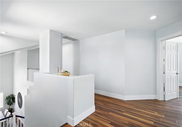 27170 Arrow Point Trl, Corona, CA 92883 - hallway with baseboards, dark wood-type flooring, recessed lighting, and an upstairs landing