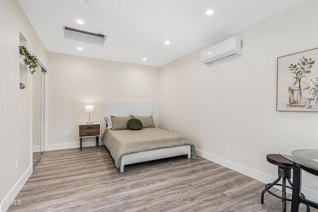 15233 Camarillo St, Sherman Oaks, CA 91403 - bedroom with a wall mounted AC, wood finished floors, baseboards, and recessed lighting