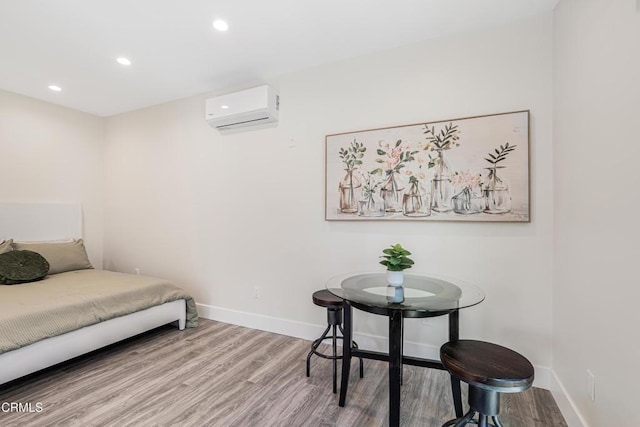 15233 Camarillo St, Sherman Oaks, CA 91403 - bedroom featuring a wall mounted AC, wood finished floors, baseboards, and recessed lighting