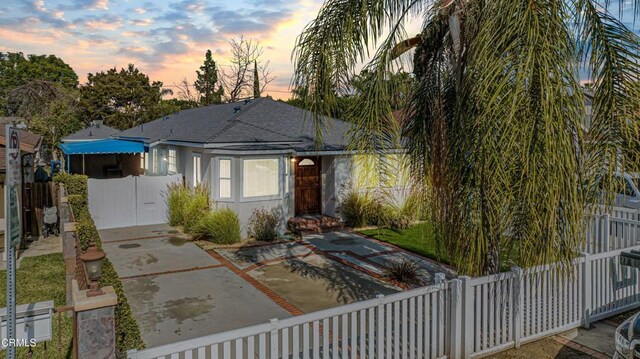 15233 Camarillo St, Sherman Oaks, CA 91403 - view of front of home with a shingled roof and a patio