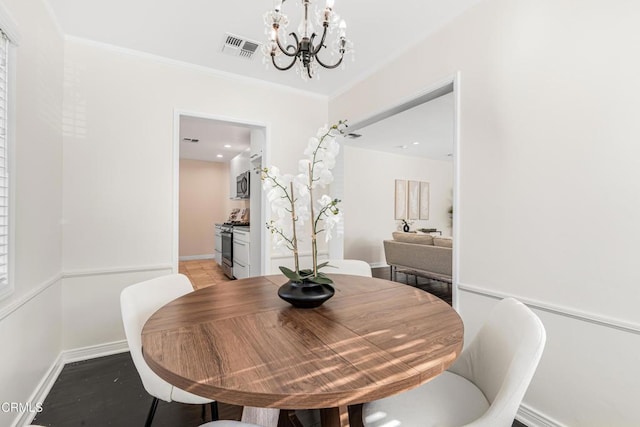 15233 Camarillo St, Sherman Oaks, CA 91403 - dining space featuring a chandelier, baseboards, and ornamental molding