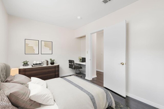 15233 Camarillo St, Sherman Oaks, CA 91403 - bedroom with baseboards and dark wood-style flooring