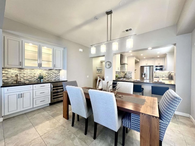 111 Sequoia Ave Unit C, Carlsbad, CA 92008 - dining area featuring bar with sink and beverage cooler