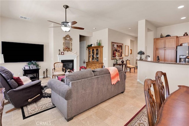 19423 Crystal Springs Ln, Apple Valley, CA 92308 - living room featuring a fireplace, recessed lighting, a ceiling fan, and baseboards
