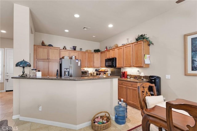 19423 Crystal Springs Ln, Apple Valley, CA 92308 - kitchen featuring stainless steel fridge with ice dispenser, black microwave, dark stone countertops, recessed lighting, and a center island