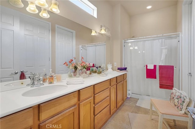 19423 Crystal Springs Ln, Apple Valley, CA 92308 - bathroom featuring a shower stall, double vanity, tile patterned flooring, a chandelier, and recessed lighting