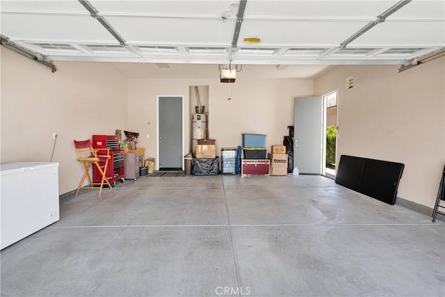 19423 Crystal Springs Ln, Apple Valley, CA 92308 - garage featuring a garage door opener, refrigerator, and water heater
