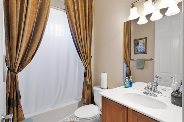 19423 Crystal Springs Ln, Apple Valley, CA 92308 - full bathroom with vanity, toilet, shower / bath combo with shower curtain, and a chandelier