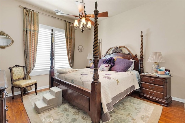 19423 Crystal Springs Ln, Apple Valley, CA 92308 - bedroom featuring multiple windows, baseboards, and wood finished floors
