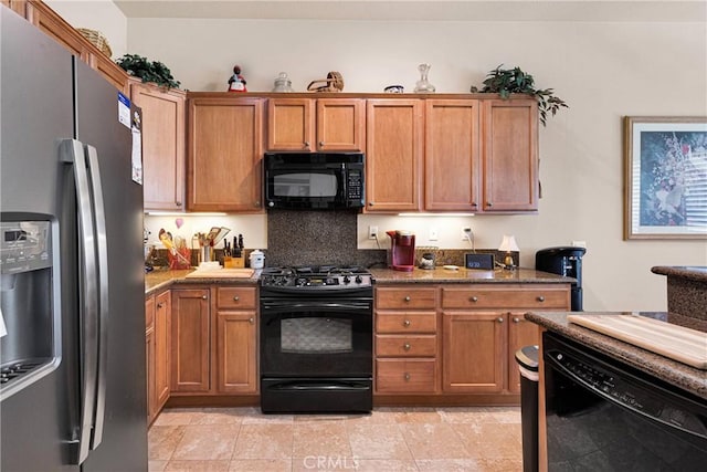 19423 Crystal Springs Ln, Apple Valley, CA 92308 - kitchen with black appliances, backsplash, brown cabinetry, and dark stone counters