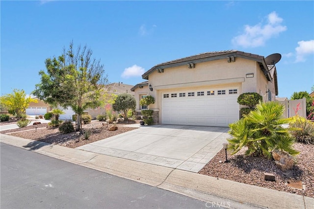 19423 Crystal Springs Ln, Apple Valley, CA 92308 - mediterranean / spanish home with a garage, stucco siding, and concrete driveway