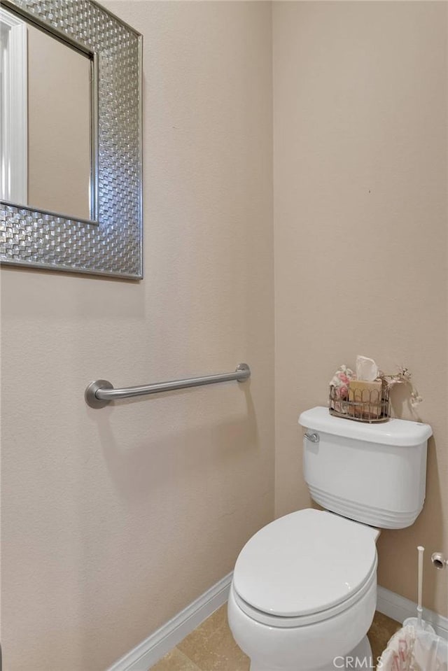 19423 Crystal Springs Ln, Apple Valley, CA 92308 - bathroom with baseboards, toilet, and tile patterned flooring