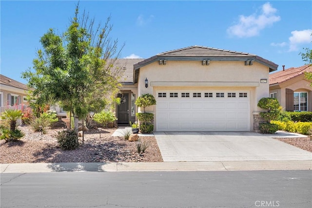 19423 Crystal Springs Ln, Apple Valley, CA 92308 - view of front of house with stucco siding, an attached garage, driveway, and a tiled roof