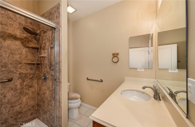 317 Calvert Park, Beaumont, CA 92223 - full bath with tile patterned flooring, vanity, and a stall shower