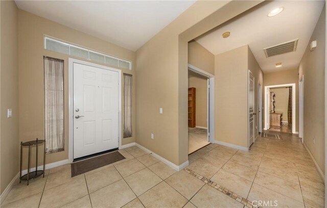317 Calvert Park, Beaumont, CA 92223 - entryway with light tile patterned flooring and baseboards