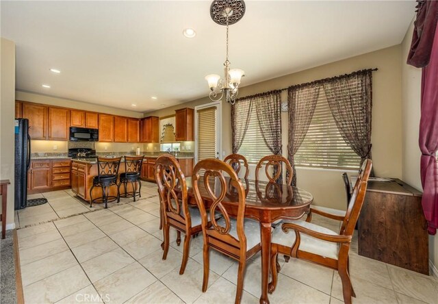 317 Calvert Park, Beaumont, CA 92223 - dining room with a chandelier, recessed lighting, and light tile patterned floors