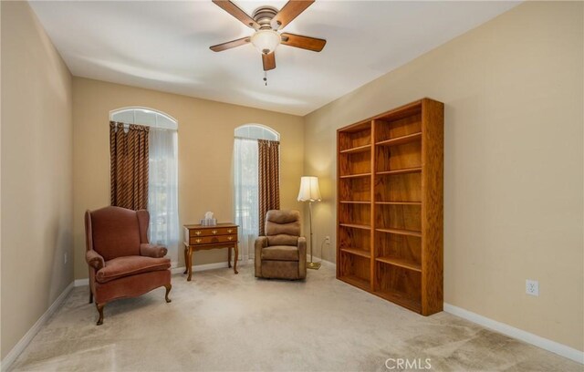 317 Calvert Park, Beaumont, CA 92223 - living area featuring a ceiling fan and carpet floors