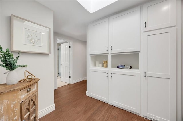 1463 Avolencia Dr, Fullerton, CA 92835 - corridor featuring light wood-style floors, baseboards, and a skylight