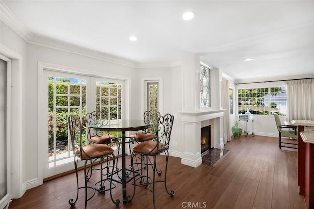 1463 Avolencia Dr, Fullerton, CA 92835 - dining area with dark wood-style flooring, ornamental molding, recessed lighting, baseboards, and a fireplace with flush hearth