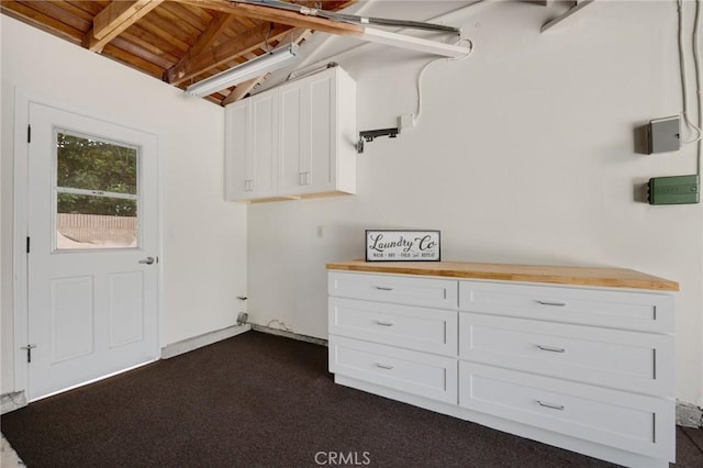 1463 Avolencia Dr, Fullerton, CA 92835 - washroom with wooden ceiling, dark carpet, and cabinet space