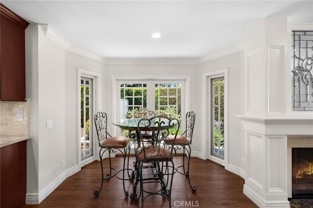 1463 Avolencia Dr, Fullerton, CA 92835 - dining room with dark wood-style floors, a glass covered fireplace, baseboards, crown molding, and recessed lighting