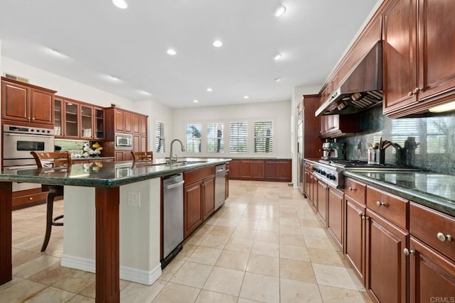 2227 Villa Verde Rd, Escondido, CA 92029 - kitchen featuring stainless steel appliances, tasteful backsplash, an island with sink, a breakfast bar, and recessed lighting
