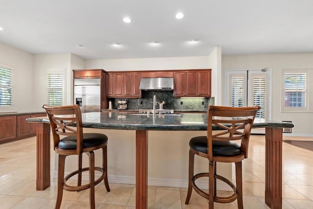 2227 Villa Verde Rd, Escondido, CA 92029 - kitchen with built in fridge, exhaust hood, plenty of natural light, a breakfast bar, and recessed lighting