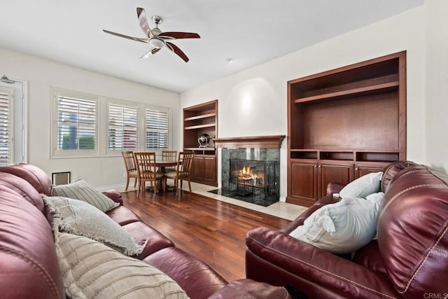 2227 Villa Verde Rd, Escondido, CA 92029 - living area with ceiling fan, wood finished floors, built in features, and a high end fireplace