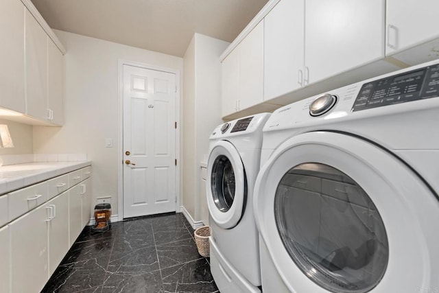 2227 Villa Verde Rd, Escondido, CA 92029 - laundry area featuring washer and clothes dryer, cabinet space, and dark marble finish flooring