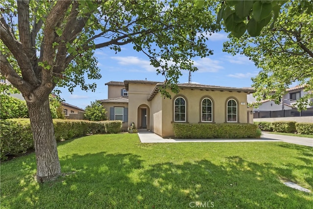 213 Caldera St, Perris, CA 92570 - mediterranean / spanish home featuring a front yard and stucco siding