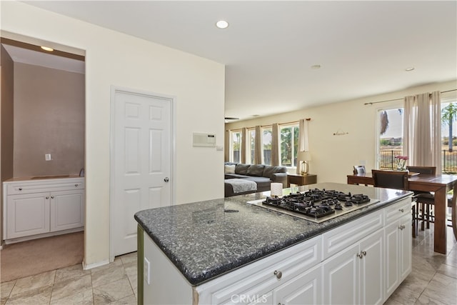213 Caldera St, Perris, CA 92570 - kitchen featuring stainless steel gas cooktop, healthy amount of natural light, white cabinetry, open floor plan, and recessed lighting
